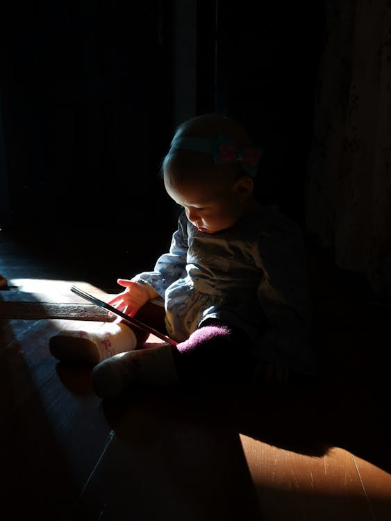 a kid playing with shadows.