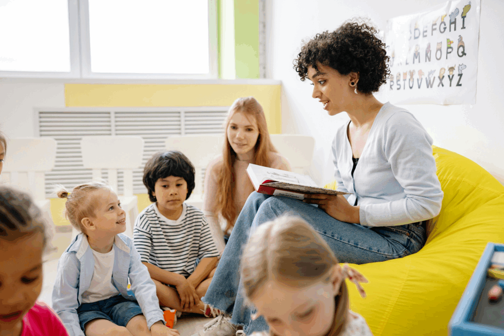 a teacher reading a book to her students