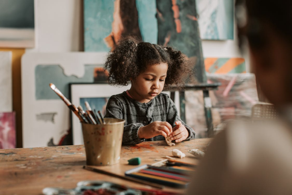 A girl engaging in sensory play