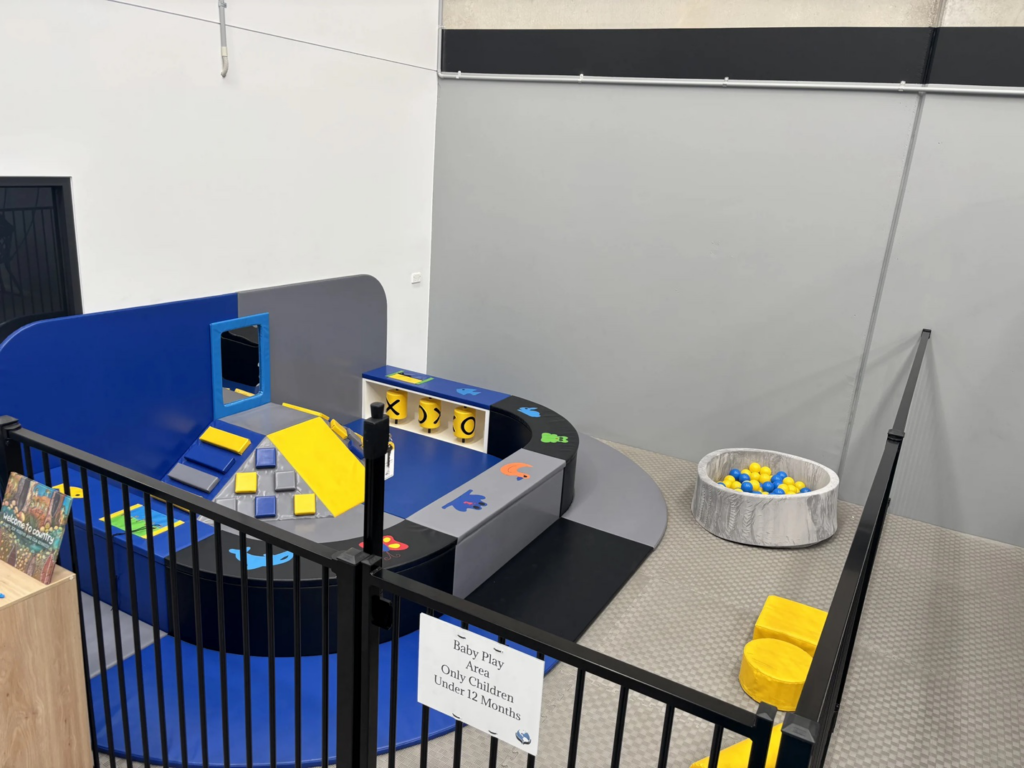 Sensory play area with soft balls and baby-friendly activities for young children